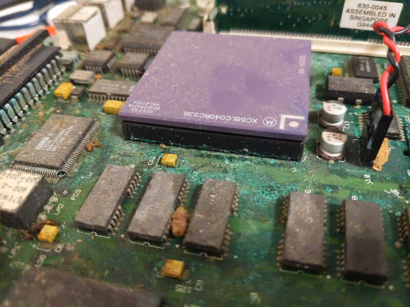 Close-up of the motherboard showing a bright-green powder